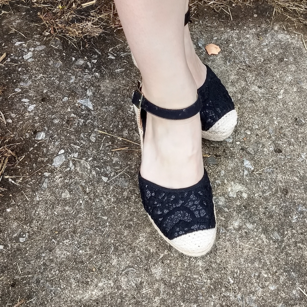 Black sequined and cloth back wedges .